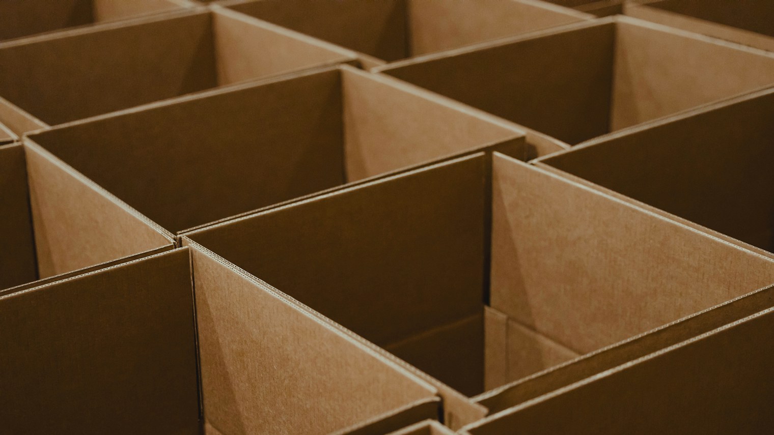 Nested open corrugated boxes in a row